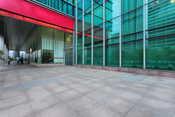 Empty road near modern building exterior