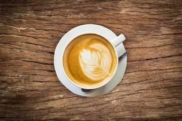 above coffee on wood texture and background with space.