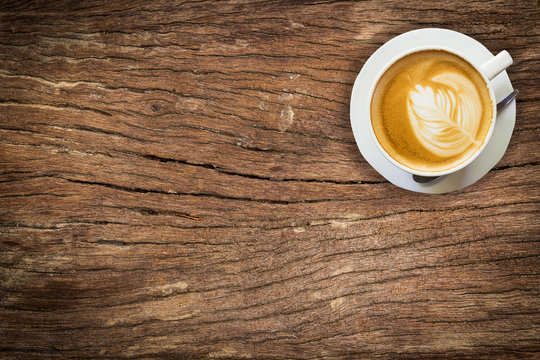 above coffee on wood texture and background with space.