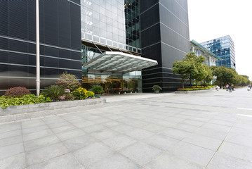 Empty road near modern building exterior