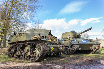 Two military tanks with blue sky