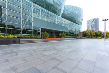 Empty road near modern building exterior