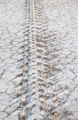 Parched ground with tire marked