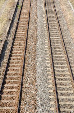 two parallel railway tracks on a sunny day