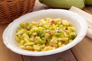 Cavatelli pasta with bacon and courgettes