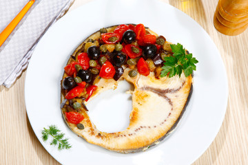 Swordish with tomatoes, capers and olives, sicilian recipe