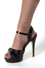 Woman legs in black shoes and vision pantyhose