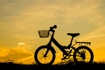 Fototapeta na wymiar Mountain bike silhouette in sunrise