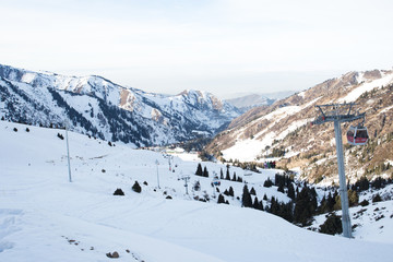 The cable car in the snowy mountains Chimbulak