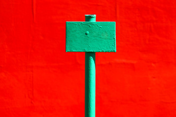 The plate against a red wall. Industrial abstraction.