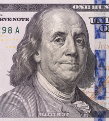 close-up portrait of Franklin with hundred dollar bills