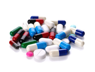 pills and capsules on white