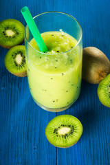 Green Smoothies of kiwi on a bright blue background