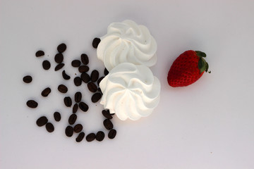 Meringue with coffee beans and strawberry