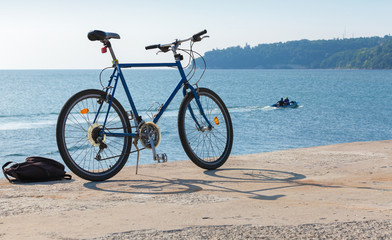 Fototapeta premium Bicycle stands on the pier, Black Sea coast