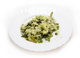 Vegetable risotto with cheese on white plate