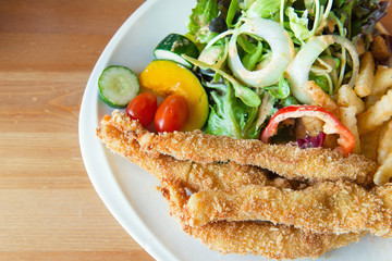 Traditional English food - Fish and chips and salad
