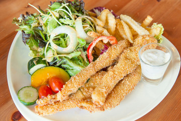 Fototapeta na wymiar Traditional English food - Fish and chips and salad