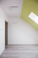 Attic room with sloped ceiling