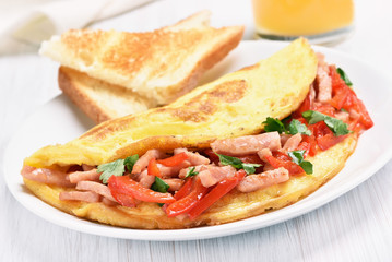 Omelette with vegetables and ham