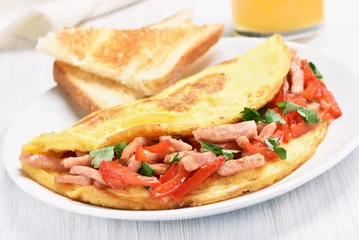 Photo sur Plexiglas Oeufs sur le plat Omelette aux légumes et jambon