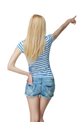 Back view Full length of young slim tanned female in denim short