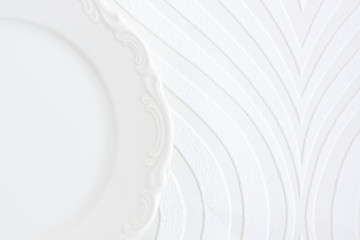 empty plate on a white striped background