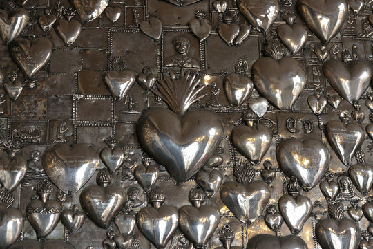 Metal hearts in the church Ostra Brama. Vilnius.