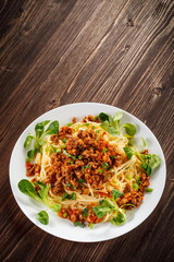 Pasta with meat, tomato sauce and vegetables