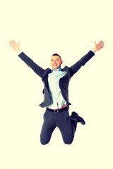 Happy businessman jumping