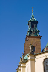 Tower and statues at the Basilica of the Archdiocese of Gniezno.