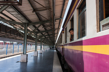 Little boy looking through window. He travels on a train.