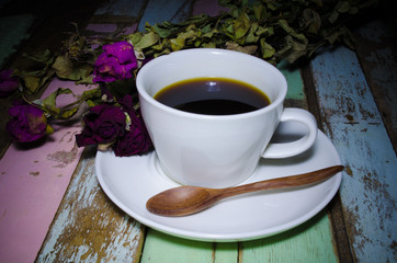 a cup of coffee on wooden background, still life