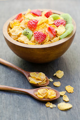 Cereals with fruit in wooden bowl