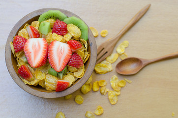 Cereals with fruit in wooden bowl