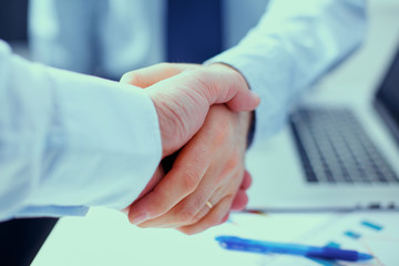 Business people shaking hands, finishing up a meeting