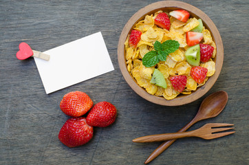 Cereals with fruit in wooden bowl