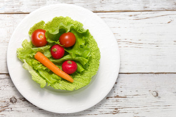 green salad on wooden table