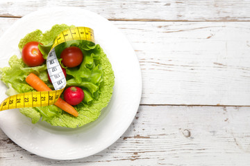 green salad with measuring tape