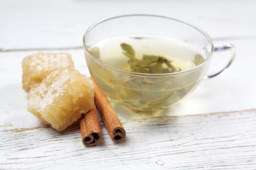 cup of tea with cinnamon and honey comb