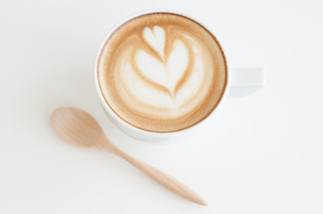 a cup of latte art on white background