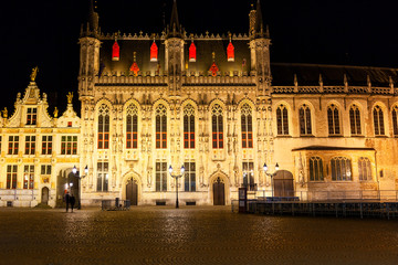 Obraz premium Stadhuis (City Hall) in Burg Square at night. Bruges, Belgium
