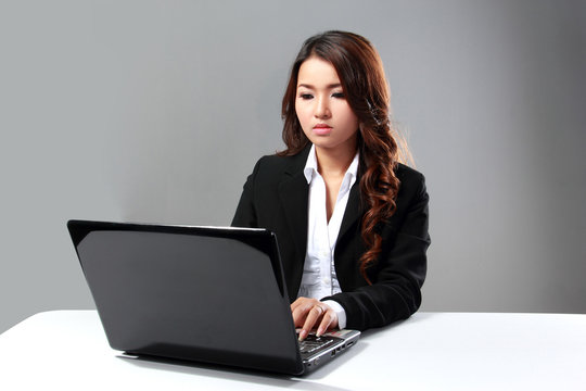 Businesswoman working with laptop
