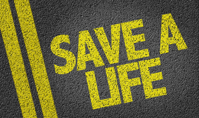 Save a Life written on the road