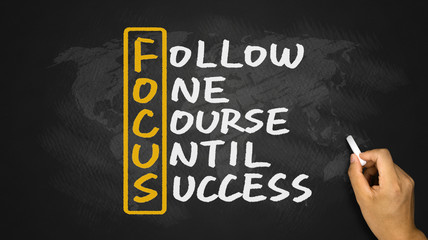 follow one course until success handwritten on blackboard
