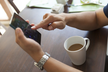 man hand finger playing or sliding on touch screen smartphone