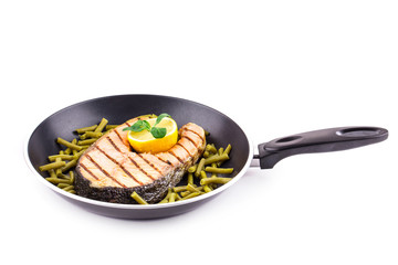 Fried salmon steak on pan as haute cuisine.