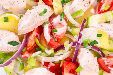 Warm meat salad with vegetables.