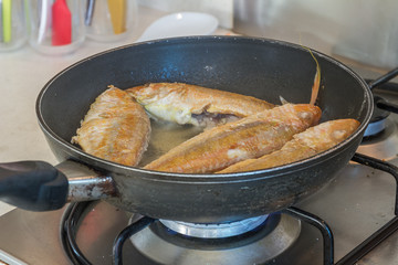 fish fillet cooking on fry pan, food preparation, cooking time