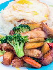 Pork stir-fried broccoli and chili with fried egg, Thai food